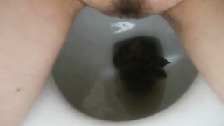Girl shitting in the toilet