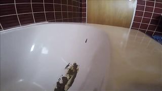 Bubble butt babe shitting in bathtub