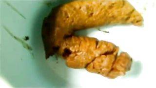 Shaved girl pooping a big one