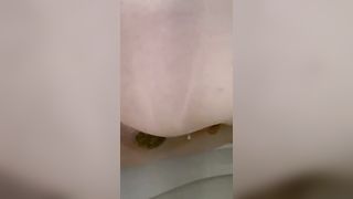 Fat babe pooping over toilet