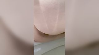 Fat babe pooping over toilet
