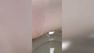Fat babe pooping over toilet