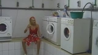 Blonde wife peeing while doing the laundry